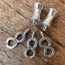 Load image into Gallery viewer, Silver, HillTribe, Concave Spool Charms, , Figure-8 Charms, Pure Silver, Hill Tribe, Curved Noodle Tube, Thailand, Karen HillTribe, Beads, Metal, Charms, Hammered, Pendants, 99.9%, Vietnam, Chasing, Hammer, Traditional Tools, Hand-Crafted, Artisans, Chasing Hammer, Silversmith, Ethnic, Jewellery, Earrings, Beaders, Bracelet, Necklace, Anklet, Tribal,